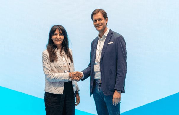 A woman and a man shake hands to mark a financing partnership between Segen and BNP Paribas Leasing Solutions.