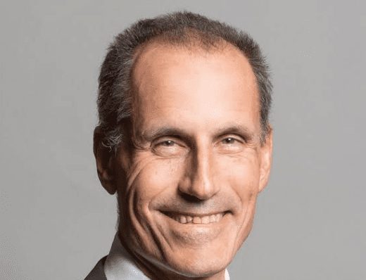 Headshot of Bill Esterson MP, smiling, in a suit and tie.