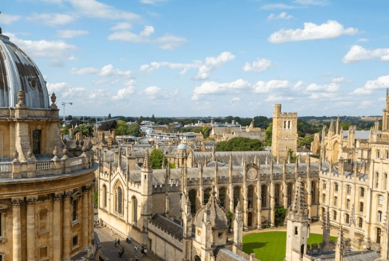 View across the Oxford skyline, with the Radcliffe Camera dome and college buildings.