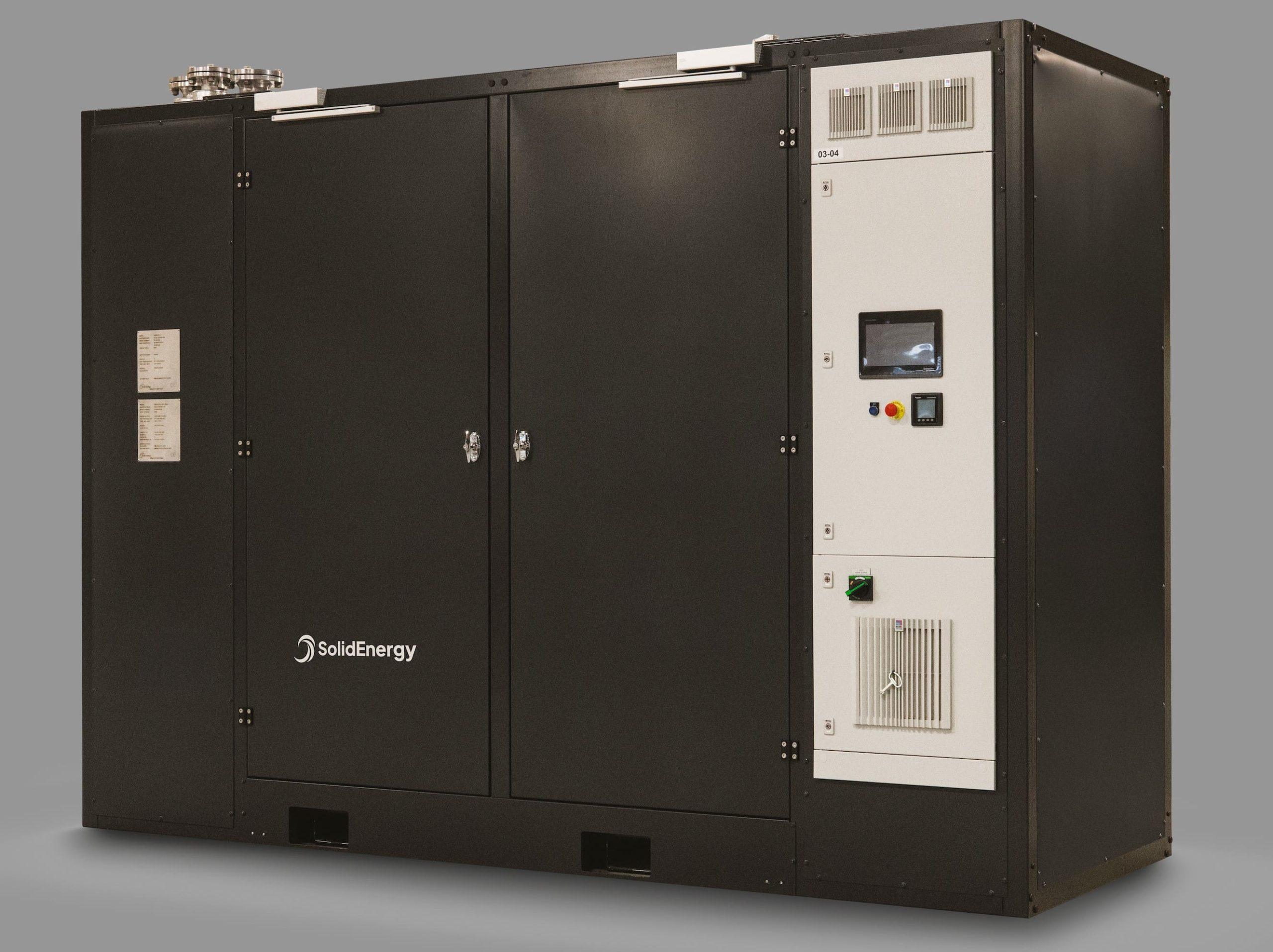 Solid Energy's high-temperature modular heat pump, a large dark grey cabinet unit.