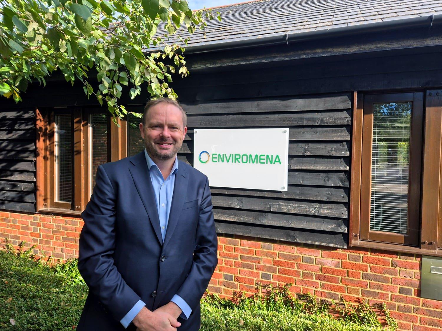 A man in a suit stands outside the Enviromena office.